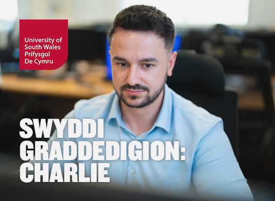 Digital Forensics Graduate William concentrates while sat at a computer in a USW computing laboratory