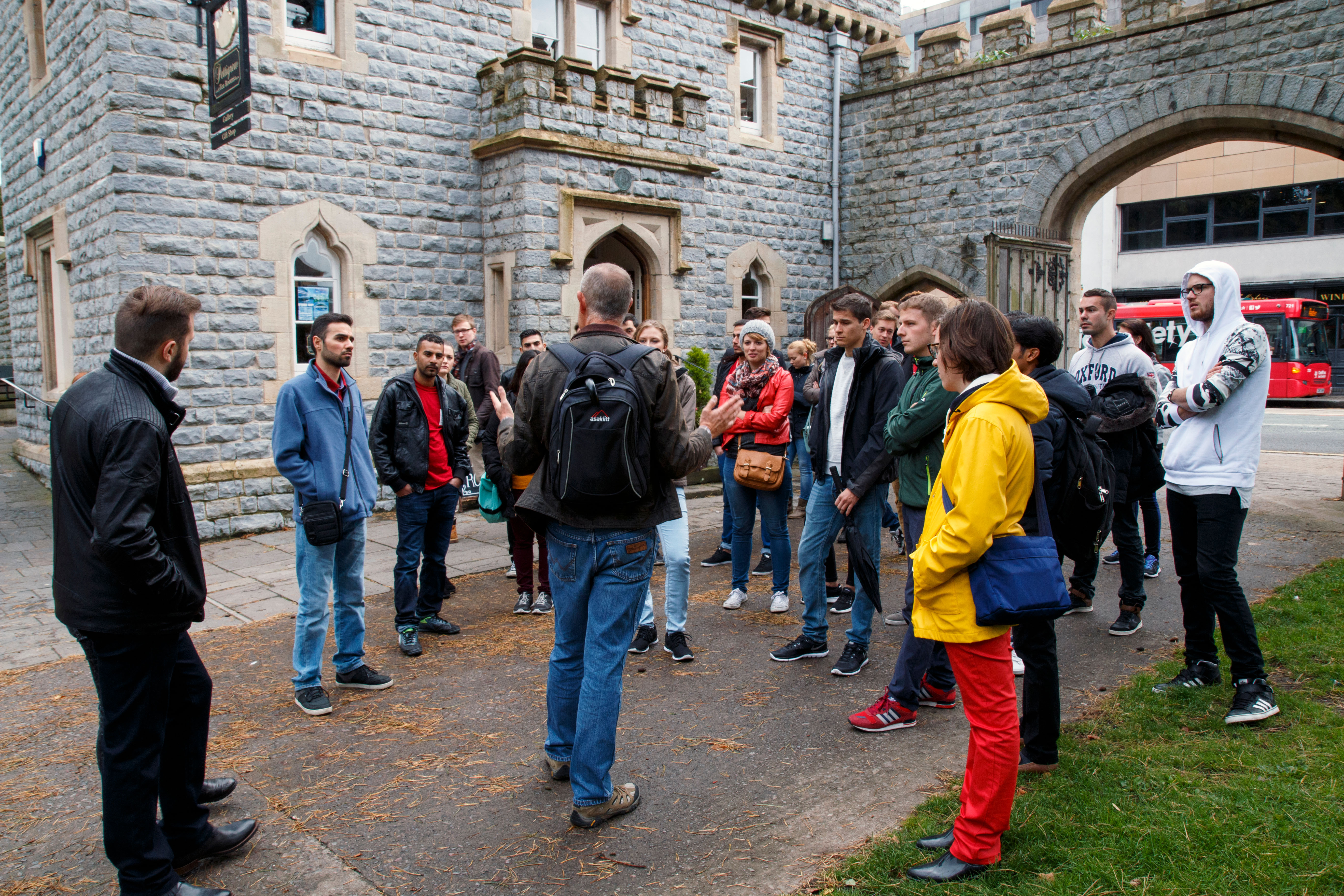 A group of students on a walking tour around Cardiff.