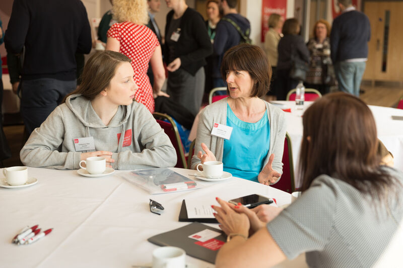 Event attendees sat at a table at the Business Futures Event held in the USW Business Exchange.