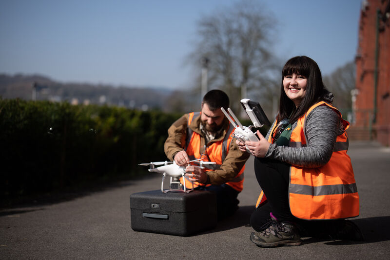 Biological Sciences Wildlife Ecology Researchers setting up a drone.