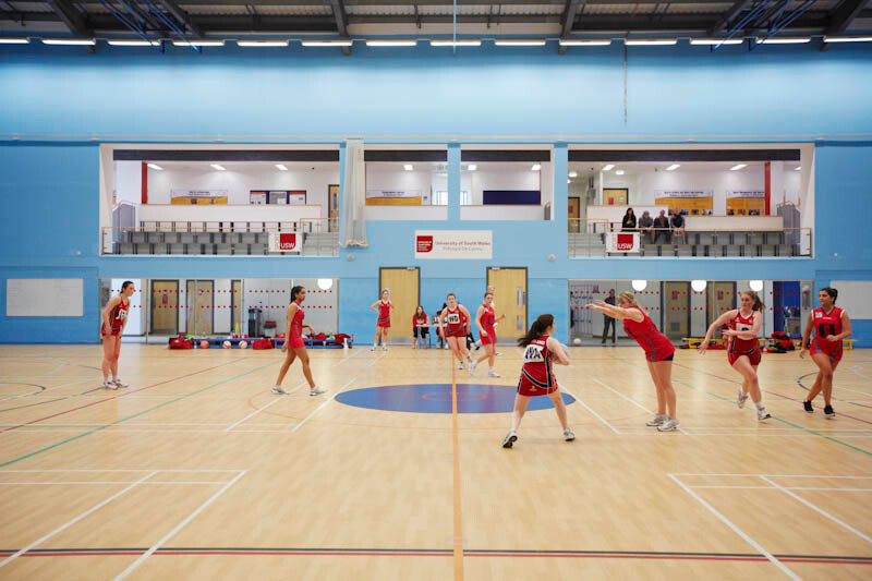 Action shot of a competitive netball game taking place at the University Sport Park.