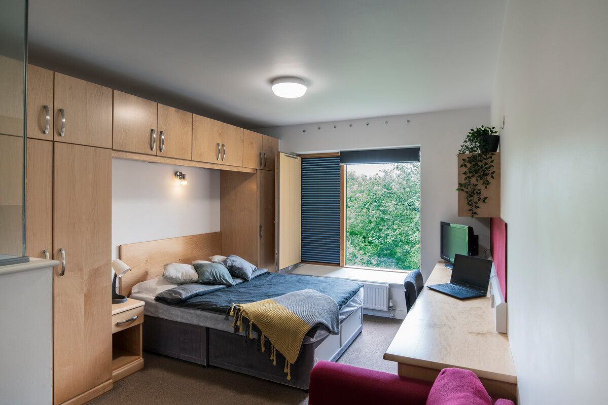 A double room at our Pontypridd accommodation featuring a large window.