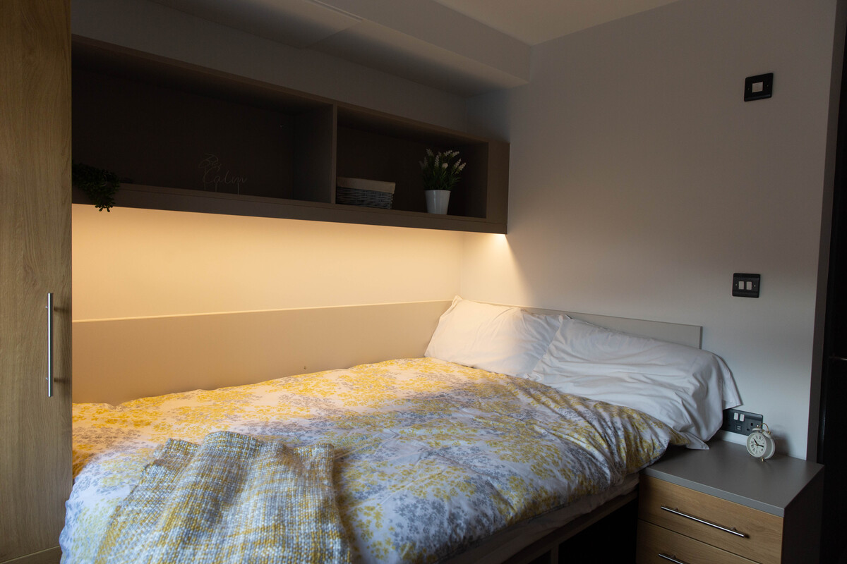 premium bedroom in glamorgan court pontypridd featuring bed and shelves