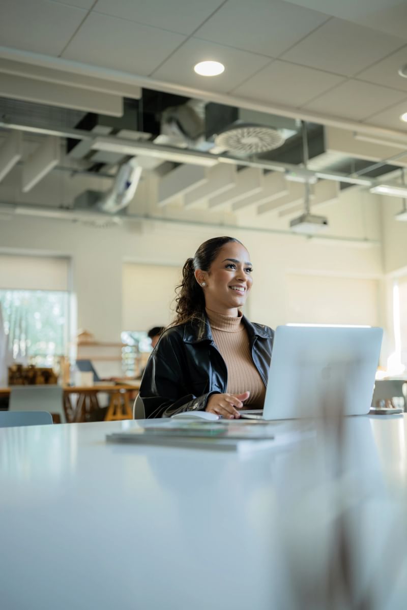 Interior design student sat at desk working