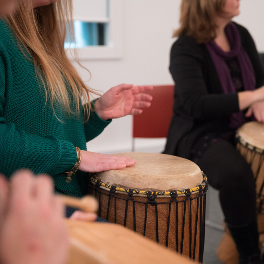 Two students playing drums