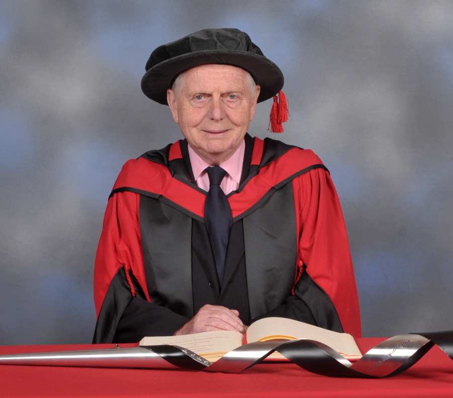 Emyr Jones-Parry smiling in cap and gown