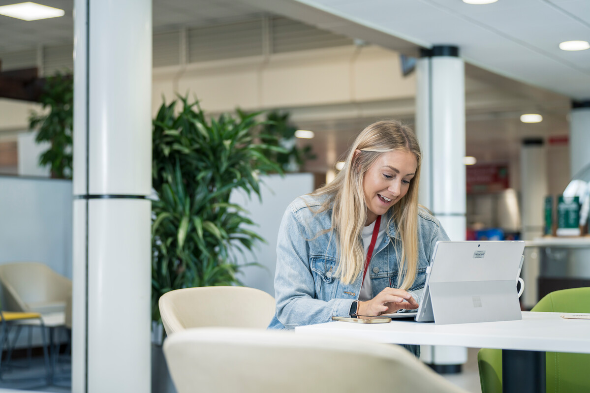 student sat on a laptop working in Stilts, Treforest