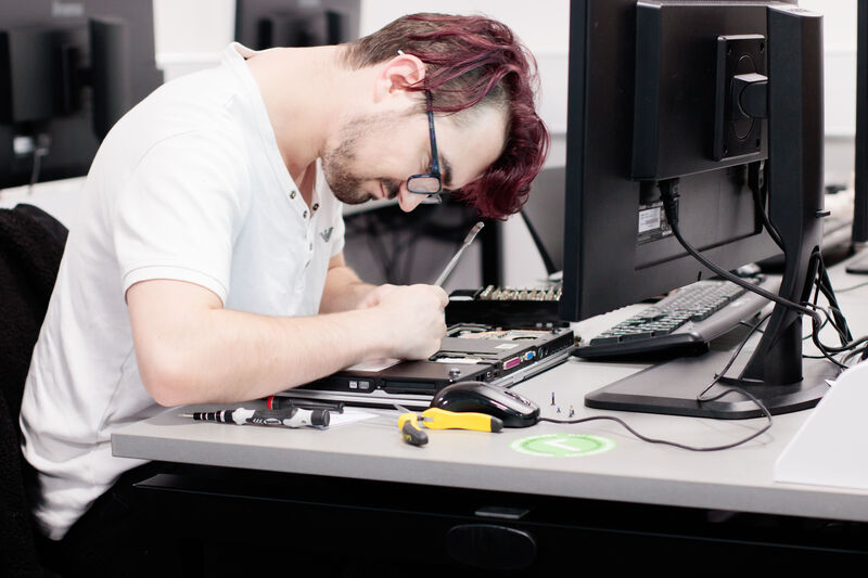 A student working in a cyber security classroom.
