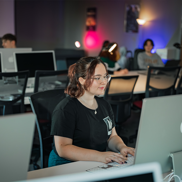 Visual Effects and Motion Graphics students working in a computer lab.