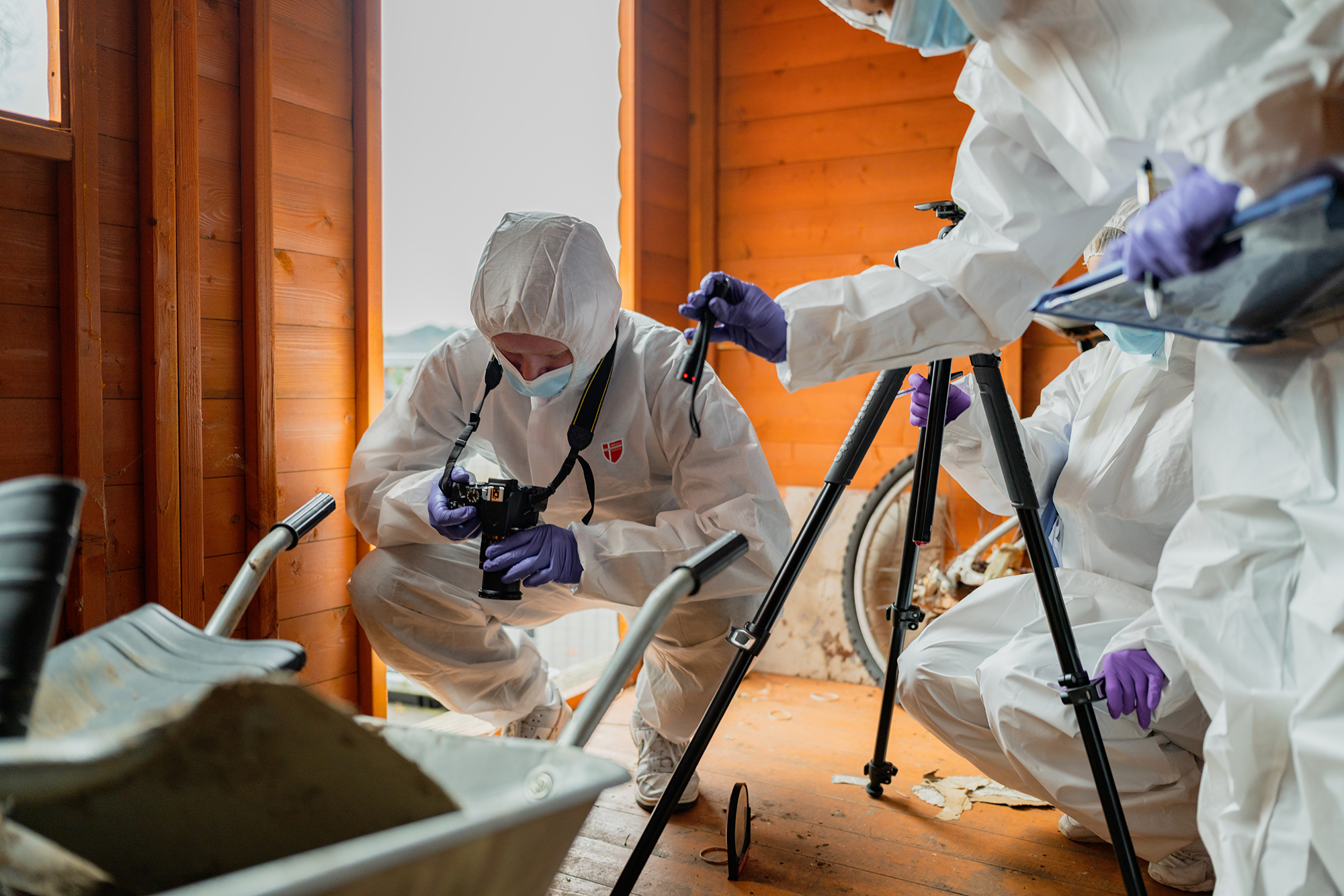 Forensic investigation students wearing PPE at a crime scene