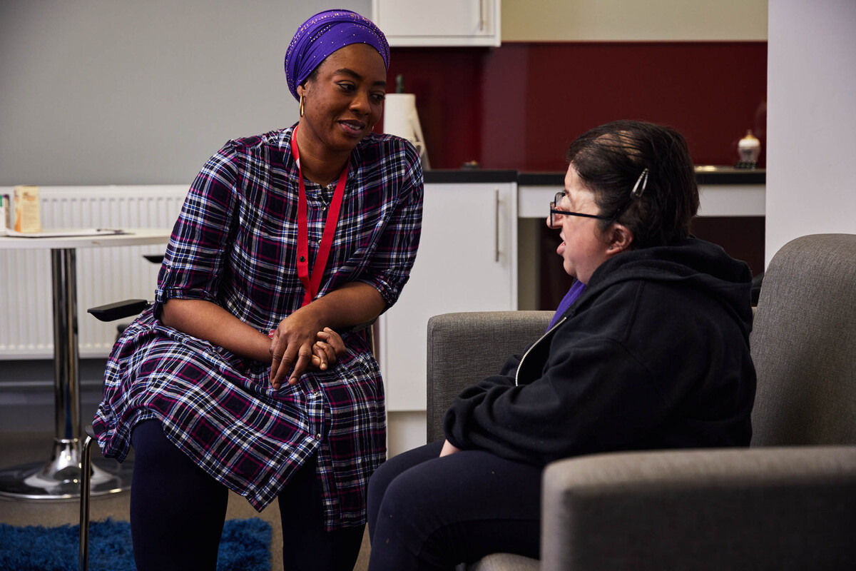 A nursing student is having a conversation with a real-life patient.