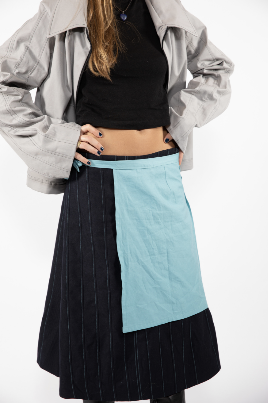 Close up of a dual colour dress and top that a model is wearing