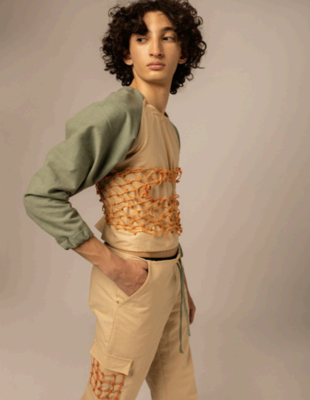 Model wearing outfit with rope material