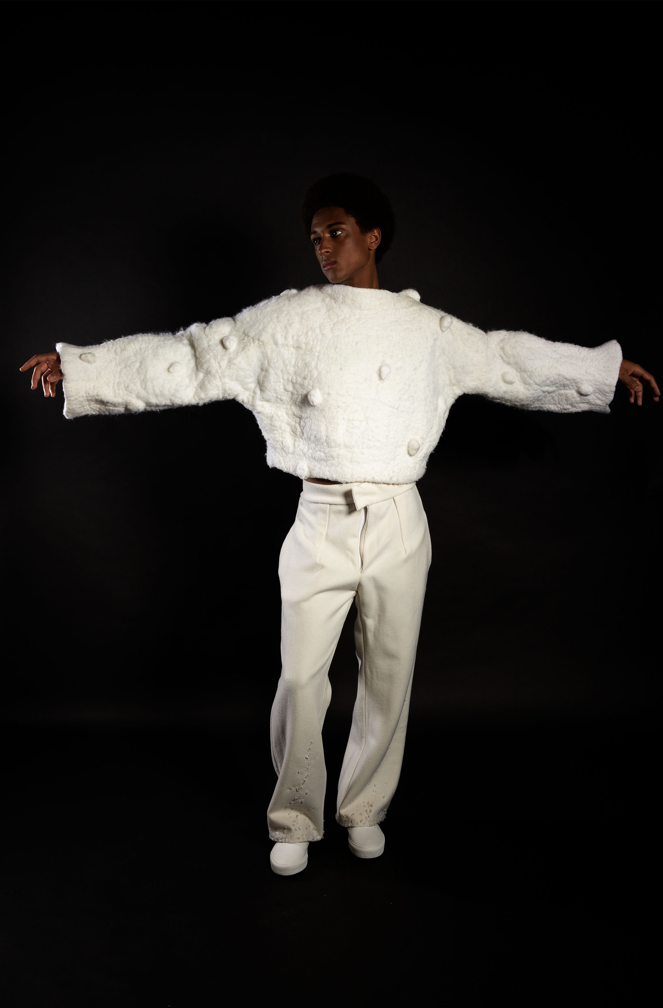 Model wearing oversized white jacket and trousers