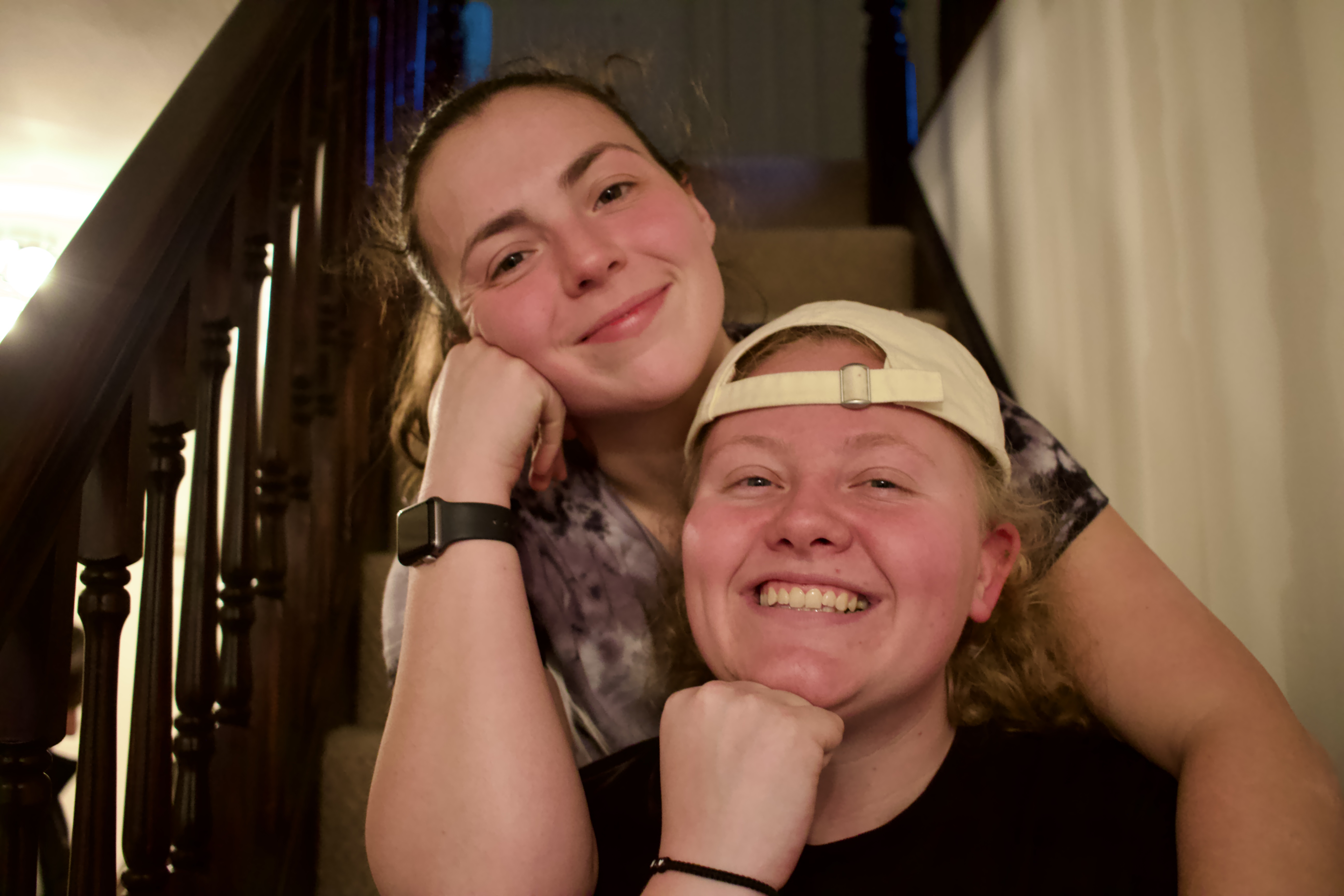 Two students smiling on the set of The Corsets film