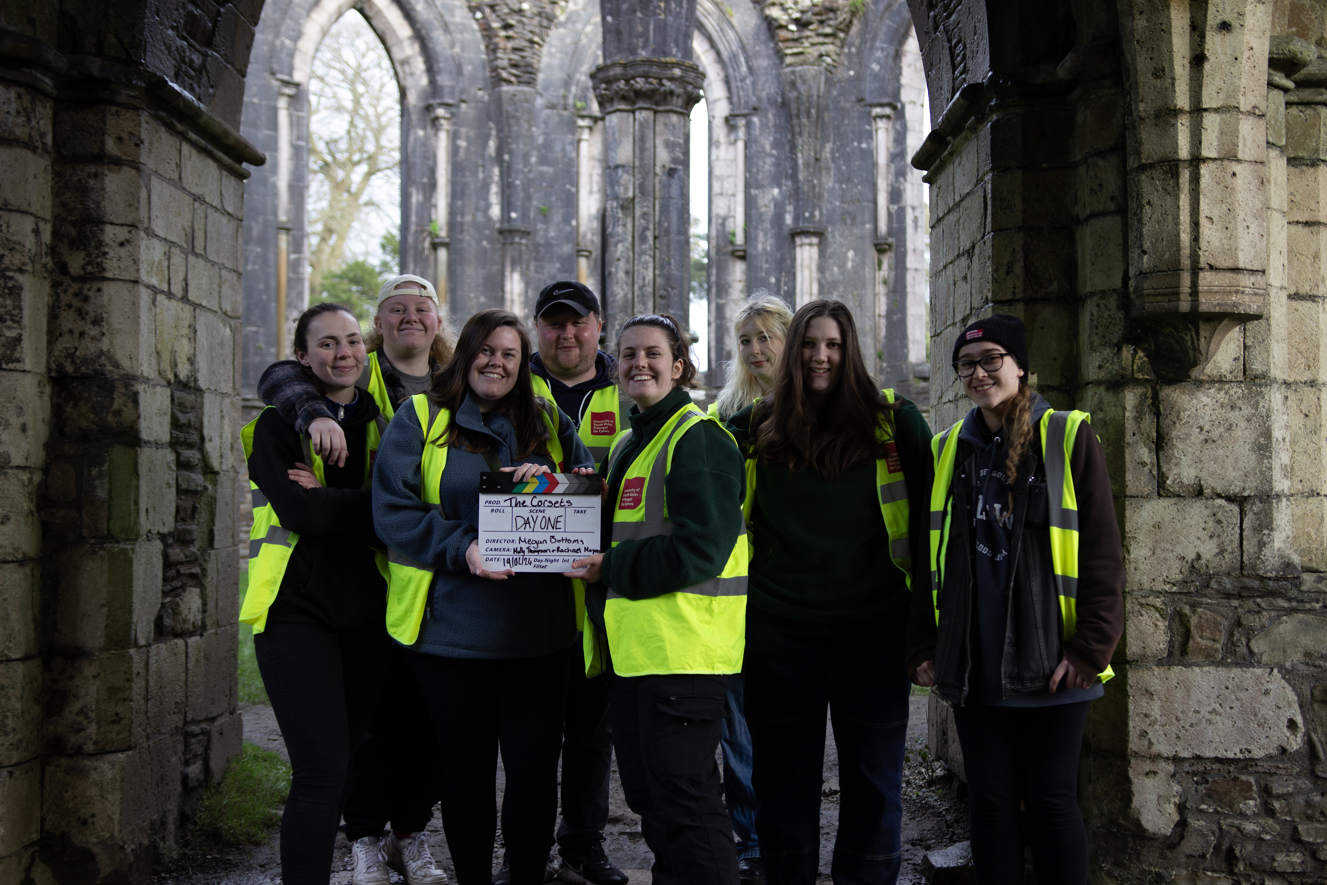 A group of students working as crew for a short film on location
