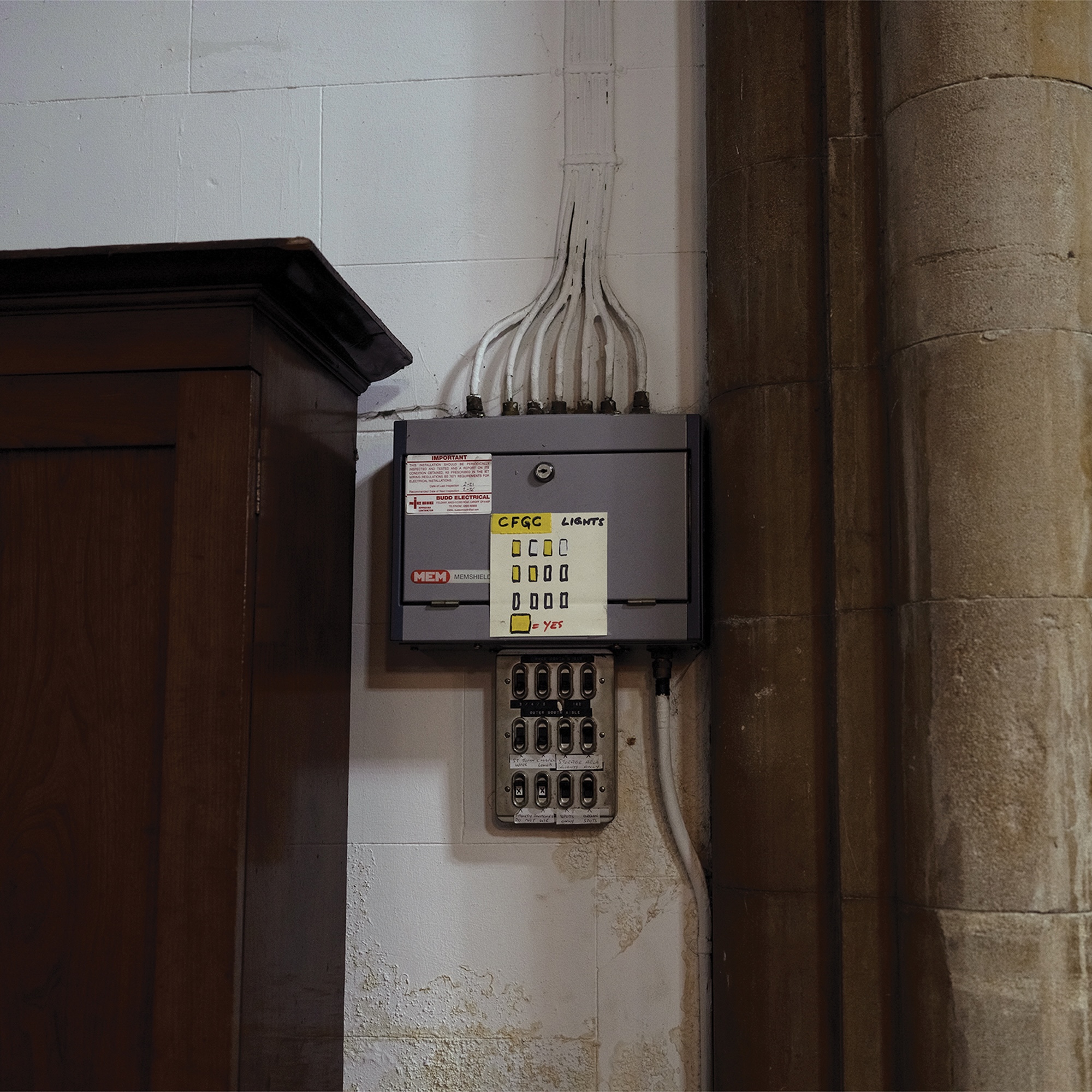 An electrical fuse box on a wall
