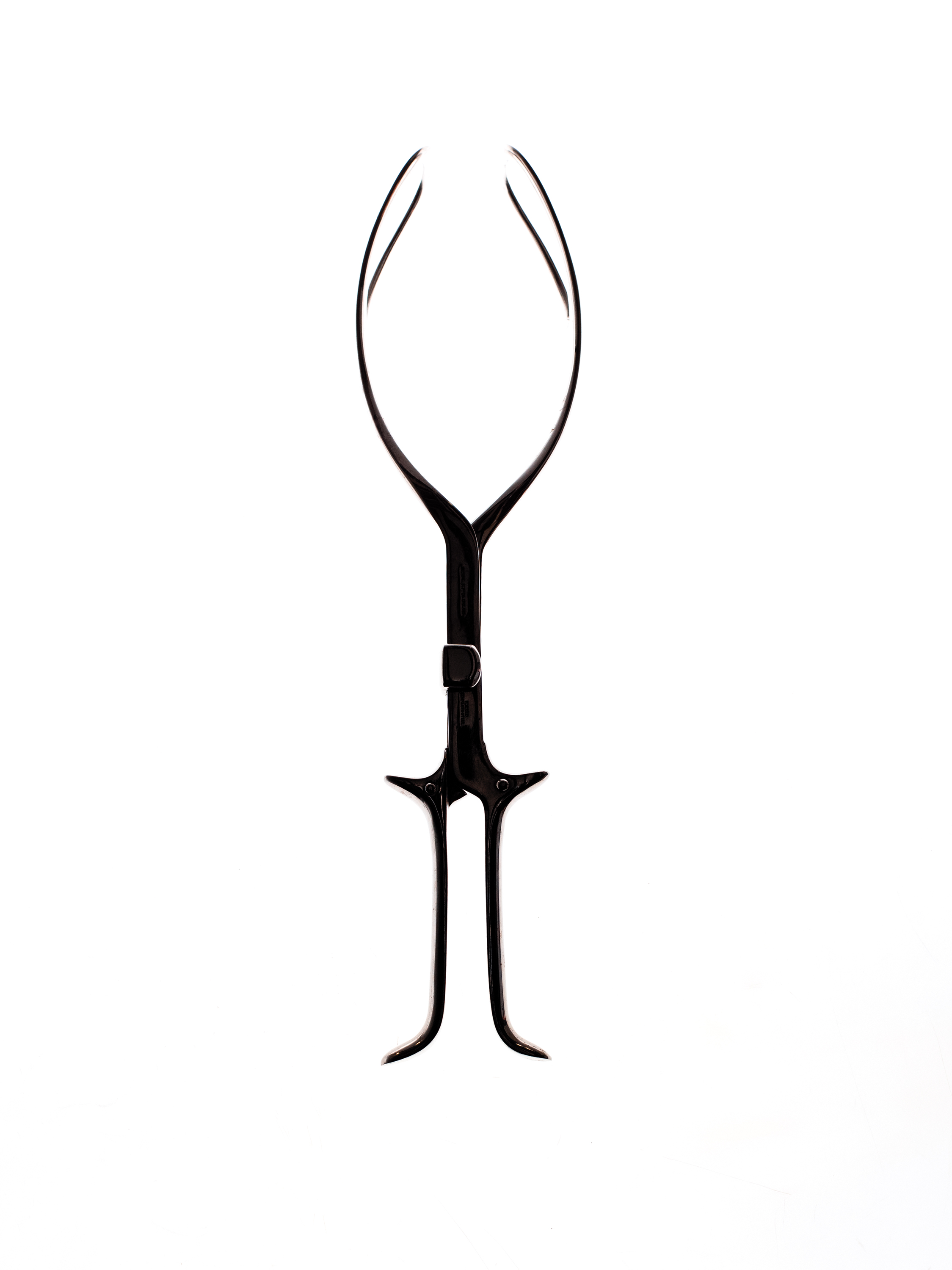 Medical birthing forceps against a white background