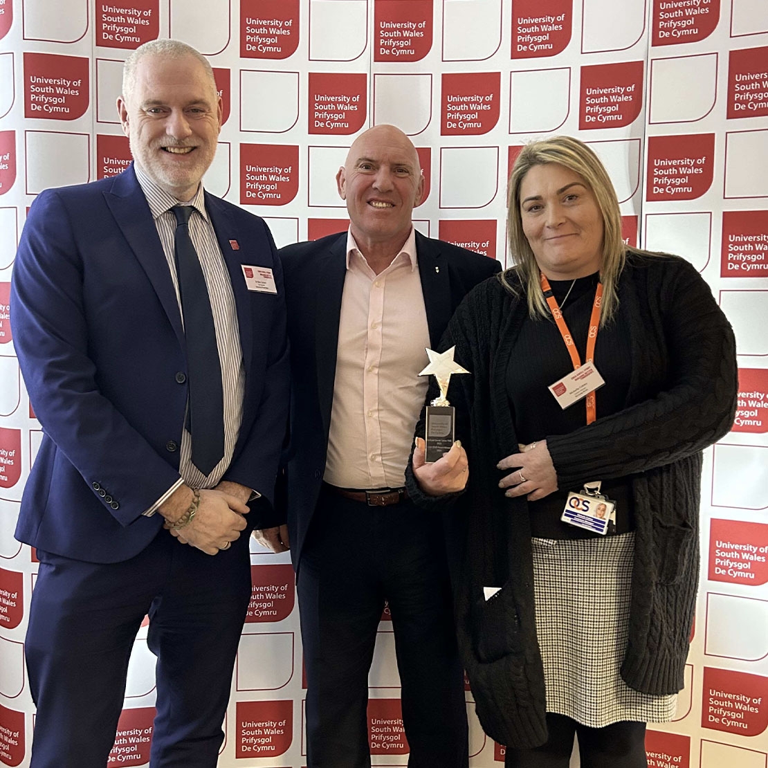 OCS, collecting the USW Star award from Dr Ben Calvert, Vice Chancellor