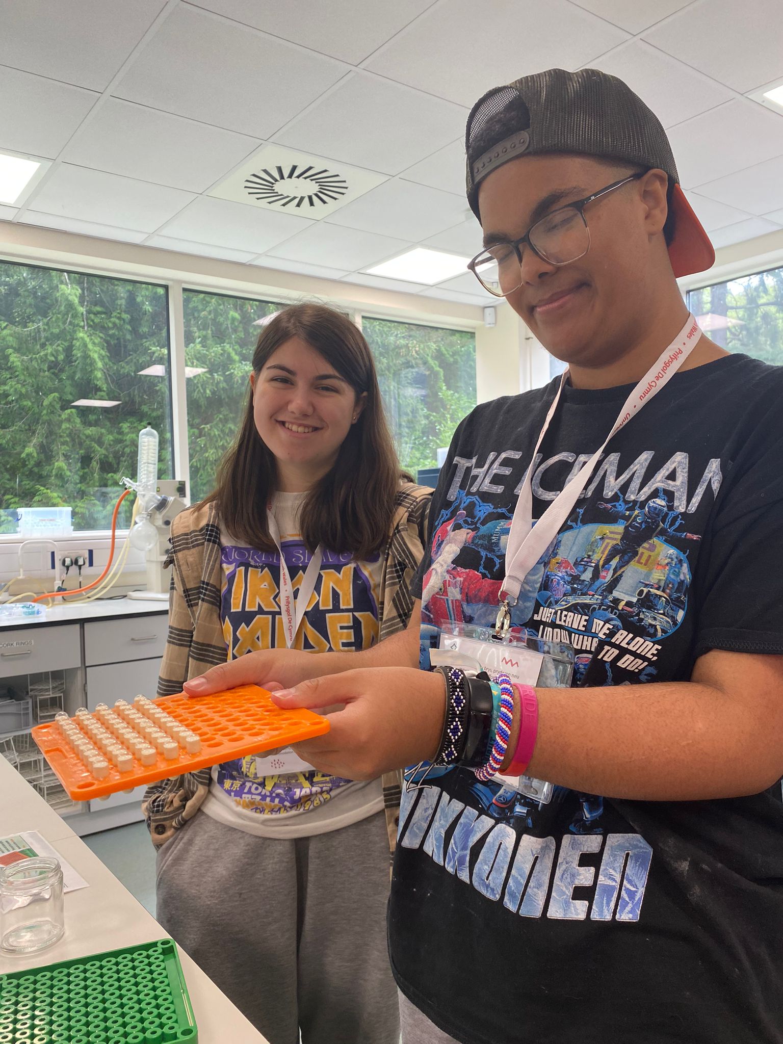 two pupils in a laboratory holding equipment