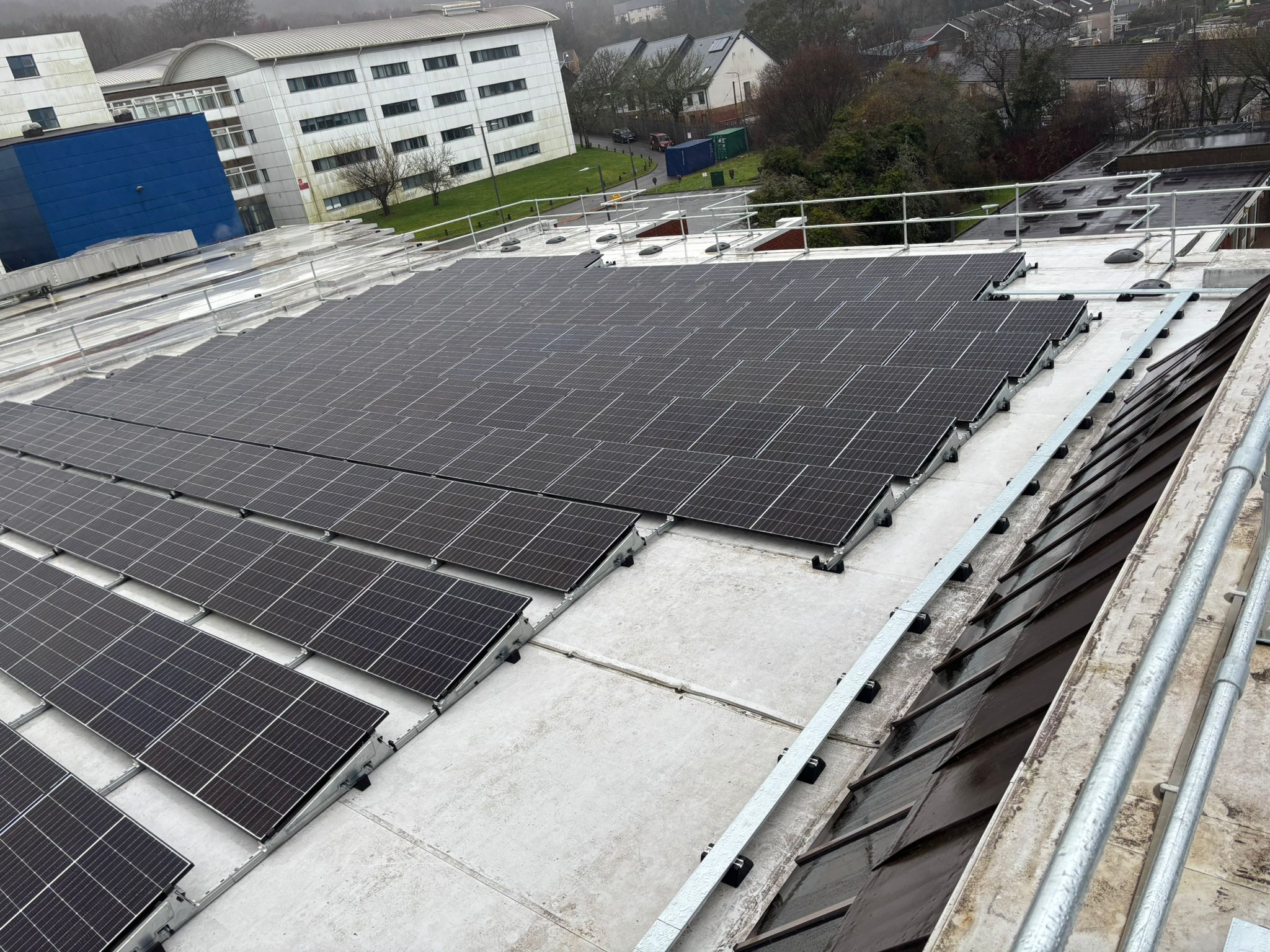 Solar panels installed on a university building roof.